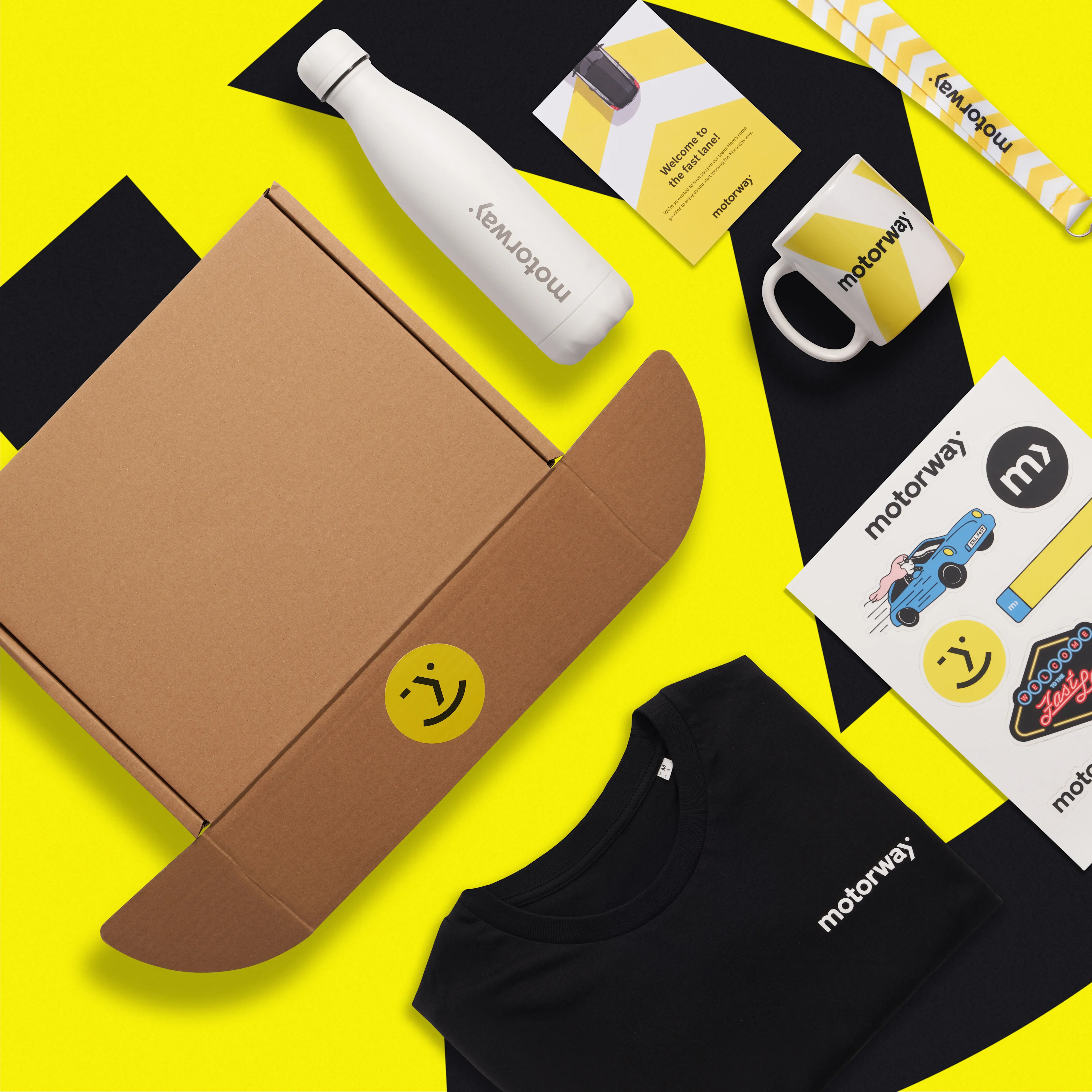 Motorway Go Swag Custom Branded Merchandise Welcome Pack Onboarding flatlay all